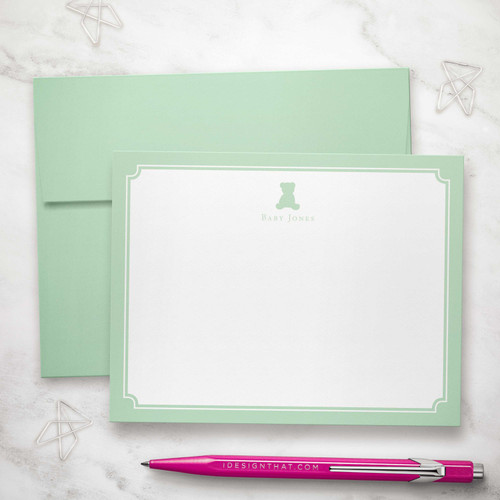 Personalized teddy bear flat notecard with mint green border and matching envelope—custom baby stationery for heartfelt notes.